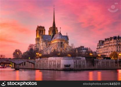 Picturesque grandiose sunset over Cathedral of Notre Dame de Paris, destroyed in a fire in 2019, Paris, France. Cathedral of Notre Dame de Paris at sunset, France