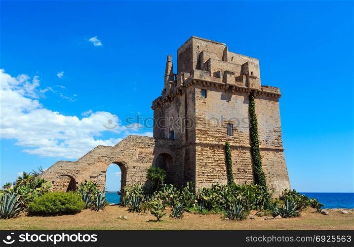 Picturesque historical fortification tower Torre Colimena on Salento Ionian sea coast, Taranto, Puglia, Italy