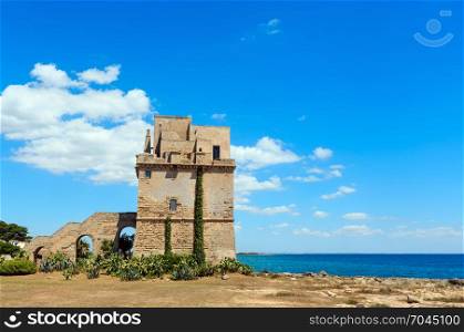 Picturesque historical fortification tower Torre Colimena on Salento Ionian sea coast, Taranto, Puglia, Italy