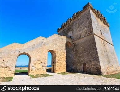 Picturesque historical fortification tower Torre Lapillo (St. Thomas Tower, Torre di San Tommaso) on Salento Ionian sea coast, Puglia, Italy