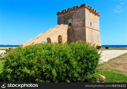 Picturesque historical fortification tower Torre Lapillo (St. Thomas Tower) Torre di San Tommaso on Salento Ionian sea coast, Puglia, Italy