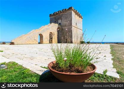 Picturesque historical fortification tower Torre Lapillo (St. Thomas Tower) Torre di San Tommaso on Salento Ionian sea coast, Puglia, Italy