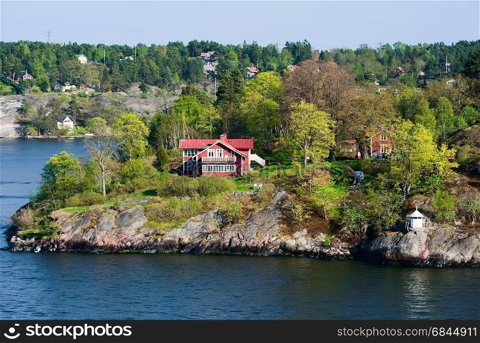 Picturesque houses on the islands, spring, Scandinavia