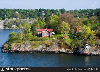 Picturesque houses on the islands, spring, Scandinavia