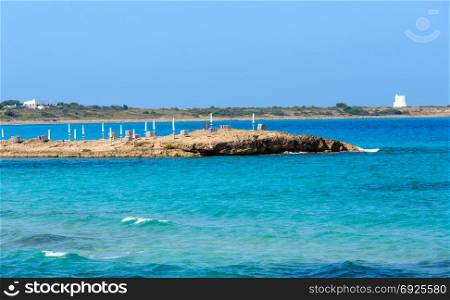 Picturesque Ionian sea beach Punta della Suina near Gallipoli&rsquo;s town in Salento, Puglia, Italy. Torre del Pizzo in far.