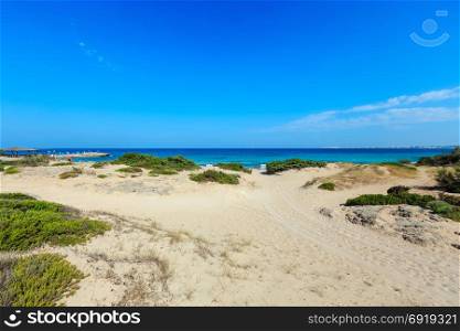 Picturesque Ionian sea beach Punta della Suina, Salento, Puglia, Italy. Gallipoli town view in far.