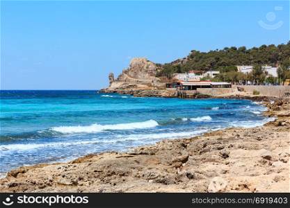 Picturesque Ionian sea coast near Montagna Spaccata rock, Santa Maria Al Bagno, Gallipoli, Salento, Puglia, Italy. People unrecognizable.