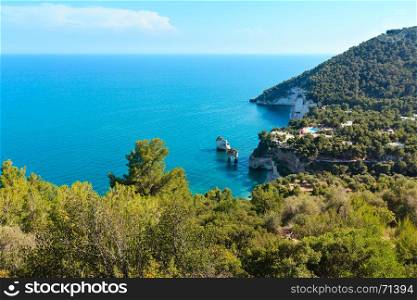 Picturesque islets Faraglioni di Puglia in summer Adriatic sea bay Baia Delle Zagare (Mattinata, Gargano peninsula, Puglia, Italy)