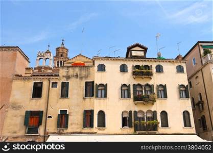 Picturesque Italian house on a background of Church Santa Maria Gloriosa dei Frari, Venice, Italy