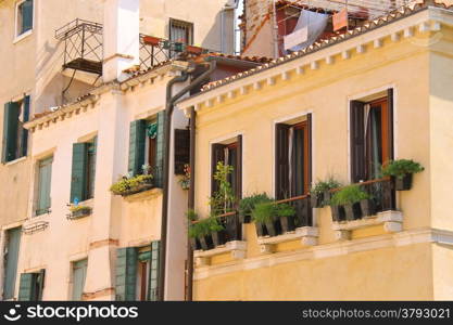 Picturesque Italian house with flowers on the balconie