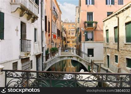 Picturesque Italian houses on a narrow canal in Venice, Italy