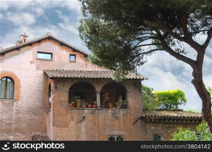 Picturesque Italian mansion under a pine tree