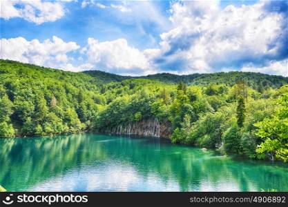 picturesque lake in forest high in mountains