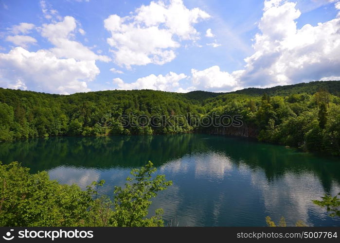 picturesque lake in forest high in mountains