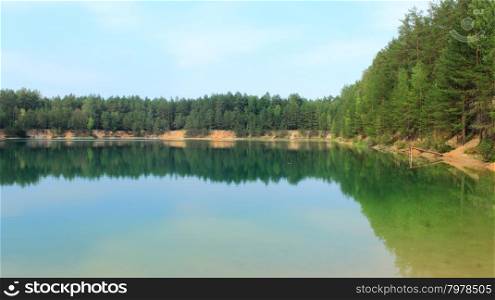 Picturesque lake in the forest. beautiful summer landscape with picturesque lake in the forest