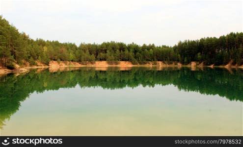 Picturesque lake in the forest. beautiful summer landscape with picturesque lake in the forest