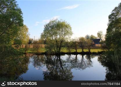 Picturesque lake in the privat possesion. beautiful spring landscape with picturesque lake in privat possesion