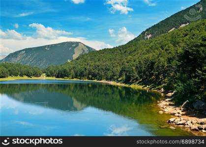 picturesque lake, mountains and blue sky