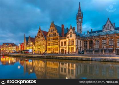 Picturesque medieval building and Clock Tower on the quay Graslei in Leie river at Ghent town at morning, Belgium