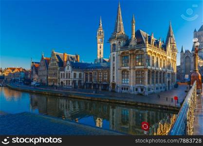 Picturesque medieval building and Post palace on the quay Graslei in Leie river at Ghent town at morning, Belgium