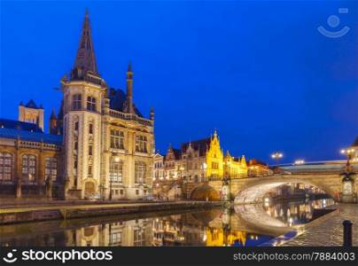 Picturesque medieval building and Post palace on the quay Graslei in Leie river at Ghent town night, Belgium