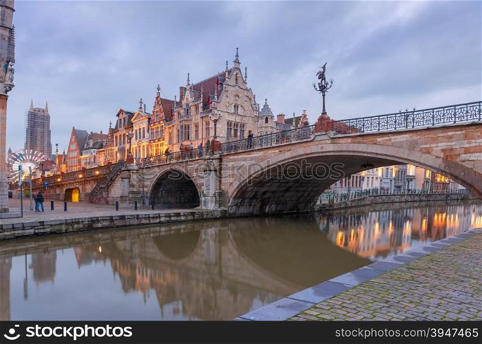 Picturesque medieval building and St. Michael&amp;#39;s Bridge in the evening in Ghent, Belgium