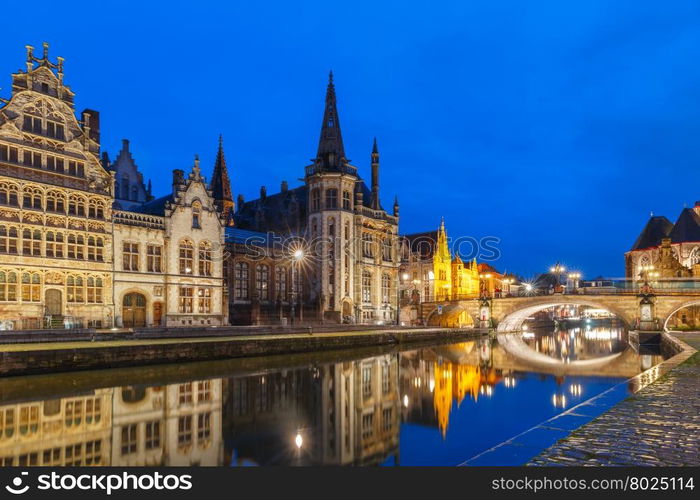 Picturesque medieval building and St Michael&amp;#39;s Bridge on the quay Graslei in Leie river at Ghent town at evening, Belgium