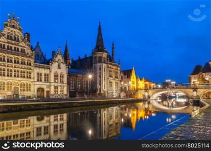Picturesque medieval building and St Michael&amp;#39;s Bridge on the quay Graslei in Leie river at Ghent town at evening, Belgium