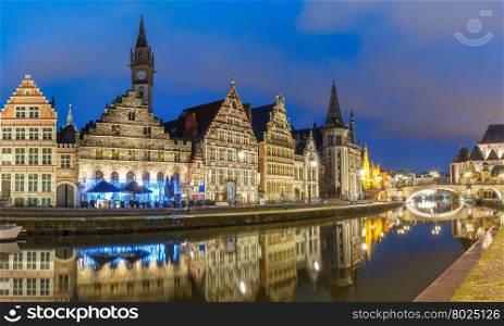 Picturesque medieval building and St Michael&amp;#39;s Bridge on the quay Graslei in Leie river at Ghent town in the evening, Belgium