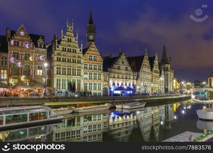 Picturesque medieval building on the quay Graslei in Leie river at Ghent town at evening, Belgium