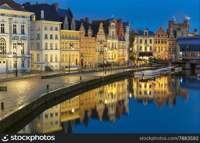 Picturesque medieval building on the quay Korenlei in Leie river at Ghent town at evening, Belgium