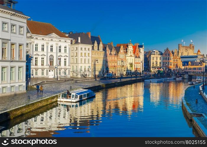 Picturesque medieval buildings on quay Korenlei and quay Graslei, Leie river in the morning, blue hour, Ghent, Belgium