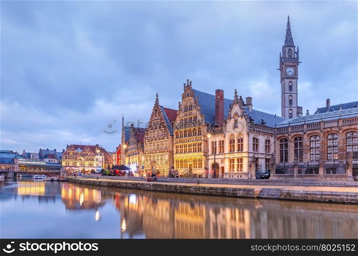 Picturesque medieval buildings on the quay Graslei and Leie river at Ghent town in the evening, Belgium