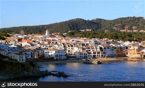 Picturesque Mediterranean fishing village in la Costa Brava, Girona.Typical Mediterranean landscape with white houses, tile roofs, wooden boats and pristine beaches.