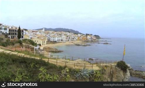 Picturesque Mediterranean fishing village in la Costa Brava, Girona.Aerial drone shot flying over the rooftops to the old center of Calella de Palafrugell.Flying over turquoise beaches with a DJI Phantom multicopter, a GoPro Hero 3 black Edition and