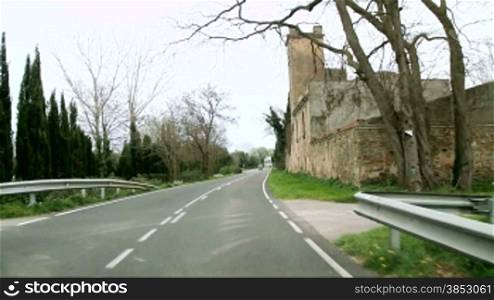 Picturesque Mediterranean rustic road camera car.Typical Emporda landscape in Girona, Catalonia.