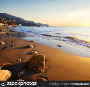 Picturesque Mediterranean seascape in Turkey. Colorful sunrise in a small bay near the Tekirova village, District of Kemer, Antalya Province