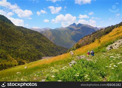 Picturesque mountain scenery and tourists on the hiking trail