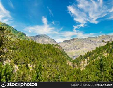 Picturesque mountains, forest and sky. Andorra, summer.