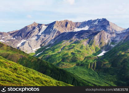 Picturesque Mountains of Alaska in summer. Snow covered massifs, glaciers and rocky peaks.