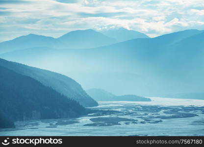 Picturesque Mountains of Alaska in summer. Snow covered massifs, glaciers and rocky peaks.