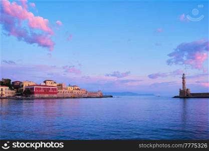 Picturesque old port of Chania is one of landmarks and tourist destinations of Crete island in the morning on sunrise. Chania, Crete, Greece. Picturesque old port of Chania, Crete island. Greece