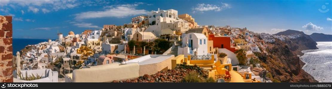 Picturesque panorama, Old Town of Oia or Ia on the island Santorini, white houses, windmills and church with blue domes, Greece. Panorama of Oia or Ia, Santorini, Greece