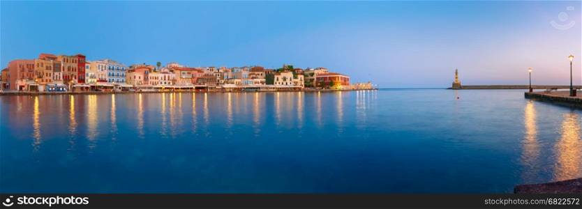 Picturesque panoramic view of old harbour with Lighthouse of Chania at sunrise, Crete, Greece