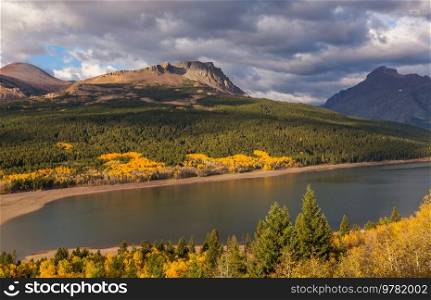 Picturesque rocky peaks of the Glacier National Park, Montana, USA. Autumn season. Beautiful natural landscapes.