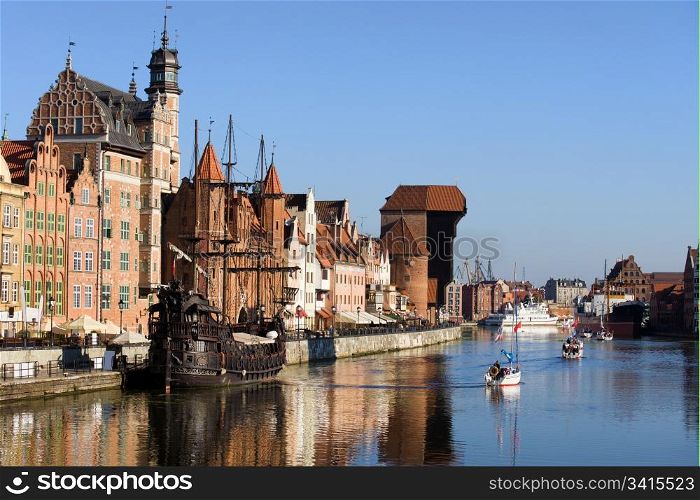 Picturesque scenery in the Old Town of Gdansk (Danzig) in Poland with Motlava river and the Crane on the far end