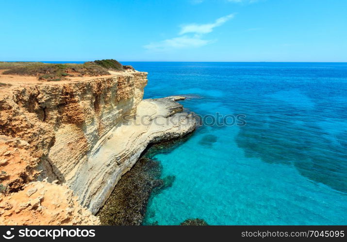 Picturesque seascape with cliffs and clear water, at Torre Sant Andrea, Salento sea coast, Puglia, Italy