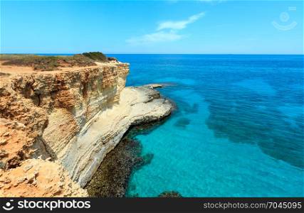 Picturesque seascape with cliffs and clear water, at Torre Sant Andrea, Salento sea coast, Puglia, Italy