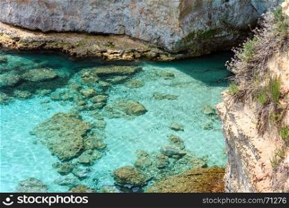 Picturesque seascape with cliffs, at Torre Sant Andrea, Salento sea coast, Puglia, Italy