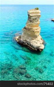 Picturesque seascape with rocky stack (faraglioni), at Torre Sant Andrea, Salento sea coast, Puglia, Italy.